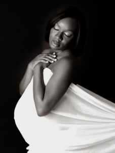 Mom-to-be in elegant black and white pregnancy photoshoot